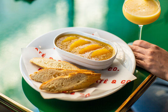 Chicken pate with orange and bread with cocktail