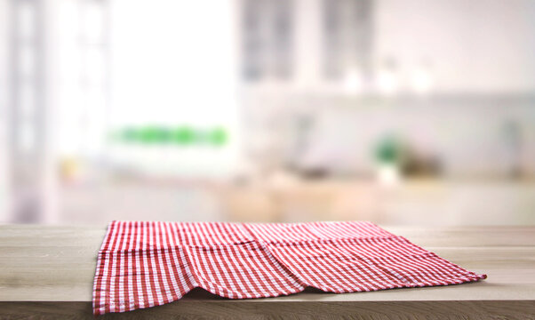 Checkered towel on wooden table. Food design layout. Tabletop. Meal advertisement background.