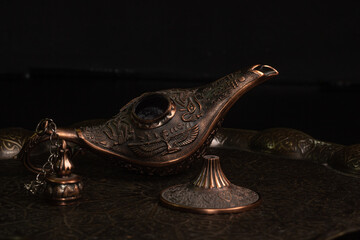 Aladdin's magic lamp isolated on black background