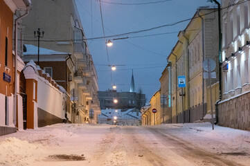 Fototapeta na wymiar Moscow, Russia - December 7, 2022: Snow-covered streets and houses of cold and winter Moscow