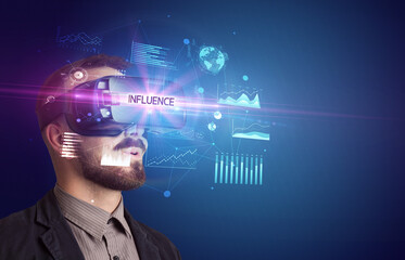Businessman looking through Virtual Reality glasses