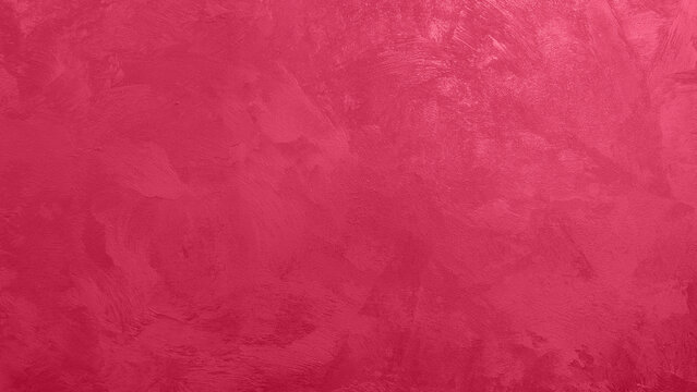 Abstract viva magenta painted texture as background with copy space.
