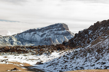 Cañadas del Teide. Snowy mountain. Mountain landscape in winter. Snowy mountain in the background. Snowy mountain in the background.Tenerife, Canary Islands, Spain.