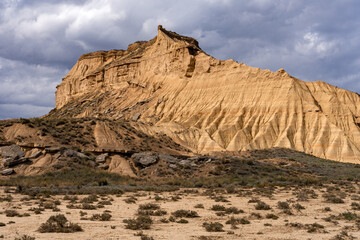 Rock formations in Piskerra zone in the desert area of Las Bardenas Reales in Navarra at sunset, Spain
