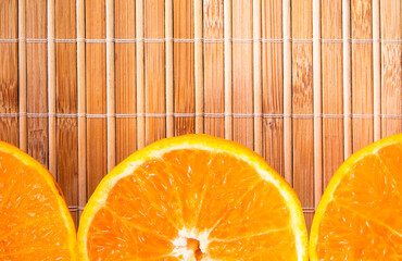 Sliced oranges and wooden background.