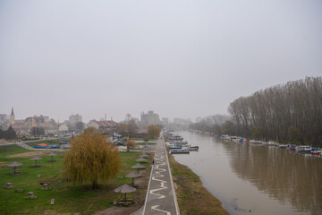 Beautiful photo of the Tamis river, on Pancevo Waterfront in the center of the city, during a foggy...