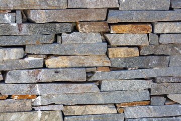 Old castle stone wall texture background. Background of textures of a stone wall. Abstract stone background. Texture of horizontal modern brick wall. Close up. Light gray rock backdrop, many blocks