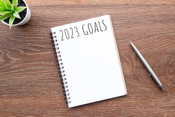 Notebook with 2023 goals text on it to apply new year resolutions and plan.