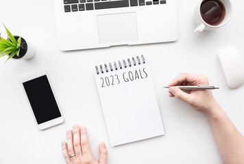 Notebook with 2023 goals text on it to apply new year resolutions and plan.