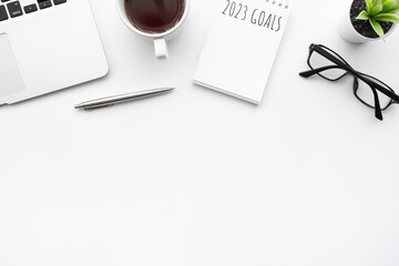 Notebook with 2023 goals text on it to apply new year resolutions and plan.