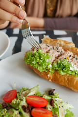 Tuna sandwich with mayonnaise on a plate on table 