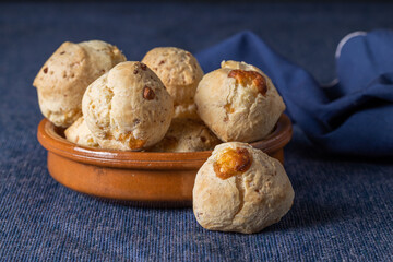 Chipa, typical Paraguayan cheese bread on blue tablecloth.