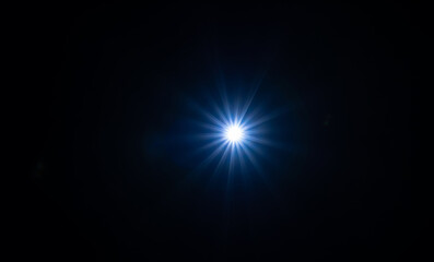 Light star illuminated on a black background.
