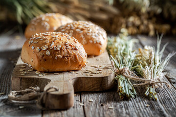 Fresh and tasty oat buns with ears of grains.