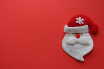 Santa Claus on a red background. Art Christmas greeting card