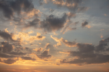 Naklejka na ściany i meble Colorful clouds at sunset as background.