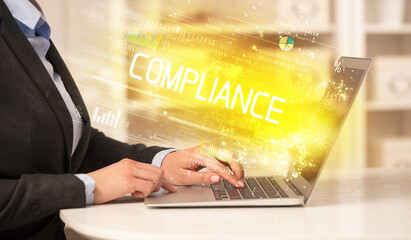 Closeup of businessman hands working on laptop