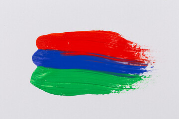 Acrylic green blue red paint on white paper