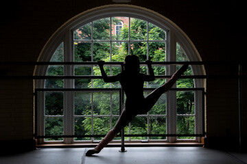 silhouette of a dancer in a window