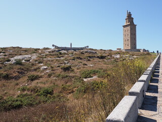 Field with tower of Hercules in A Coruna city at Galicia, Spain