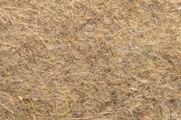 Hemp growing mat, surface and background, close-up, from above. Growth medium, made of industrial and natural hemp fibres, intertwined into a biodegradable and compostable alternative to growing soil.