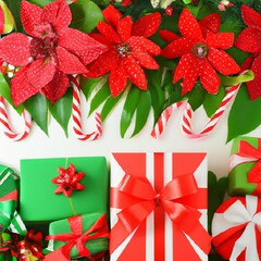 Holiday gift packages, wrapped with ribbons and bows. poinsettia, candy cane, green and red overhead group.