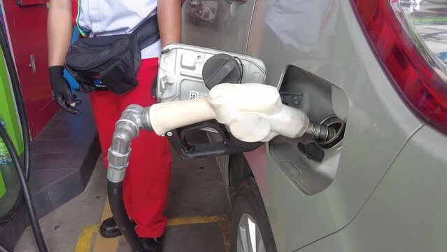Tangerang, Indonesia - December 8, 2022: Filling Pertalite gas fuel tanks at gas stations, Asia