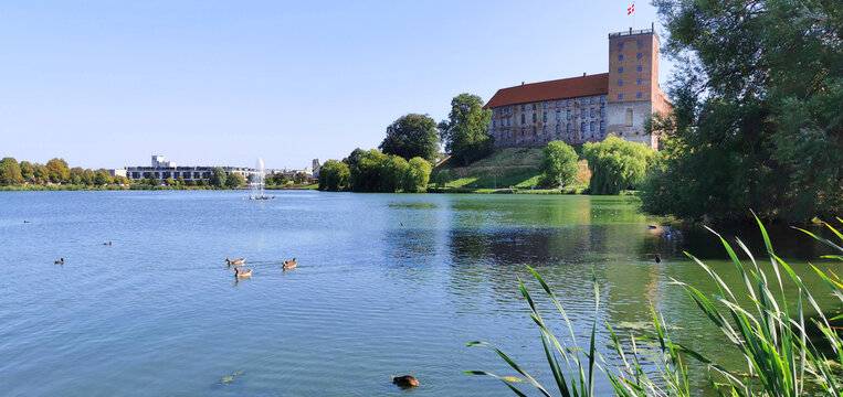 Danish old historic castle called "Koldinghus" in Kolding city by the lake with ducks