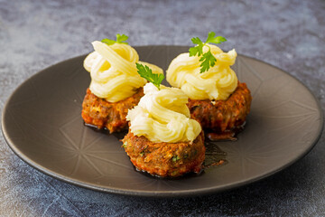 Turkish Food Hasanpasa Kofte - Kofta with Puree - Meatball with Bechamel Sauce and Green Peas. Traditional Food.