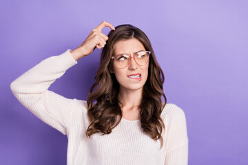 Closeup photo of funny face brunette hair woman wear white jumper scratch head bite lips questioned problems isoalted on violet color background