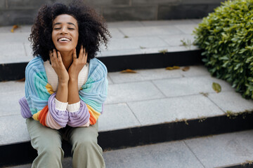 Fototapeta na wymiar Young Smiling African American woman portrait outdoors
