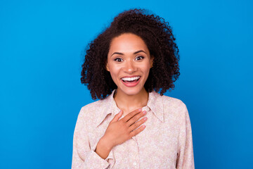 Photo of astonished crazy lady hand touch chest toothy smile isolated on blue color background