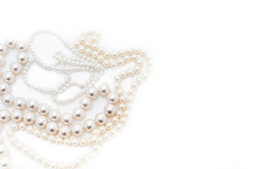 Pearl beads with beads of different sizes. Top view. Isolated