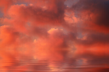 water surface with scarlet clouds at sunset