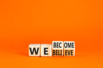 We become or believe symbol. Concept word We believe We become on wooden cubes. Beautiful orange table orange background. Business we become or believe concept. Copy space.