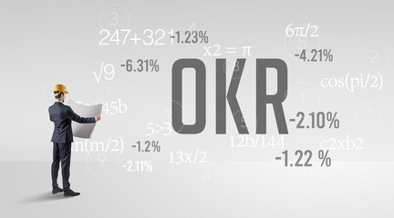 Engineer in hard hat with abbreviation