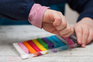 hands holding crayons