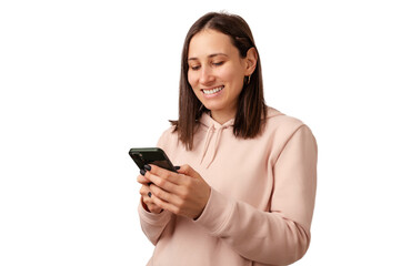 Fototapeta premium Young smiling woman is texting a message, browsing or scrolling in social media.