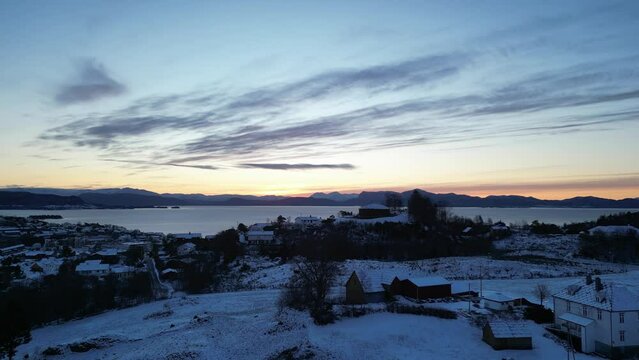 Sunrise over Bj&oslash;rnafjord and the harbor of Os&oslash;yro in Bj&oslash;rnafjorden municipality, Norway. Winter landscape.