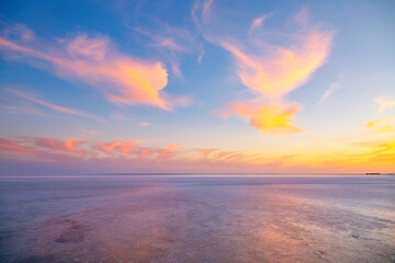Fototapeta na wymiar Incredible salt lagoon at sunset on a beautiful summer evening.
