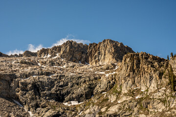Fototapeta na wymiar Ridgeline of Alta Peak with Snow Lingering on Cracks in the Cliffs