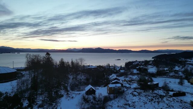 Sunrise over Bj&oslash;rnafjord and the harbor of Os&oslash;yro in Bj&oslash;rnafjorden municipality, Norway. Winter landscape.
