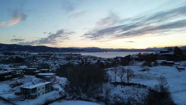 Sunrise over Bj&oslash;rnafjord and the harbor of Os&oslash;yro in Bj&oslash;rnafjorden municipality, Norway. Winter landscape.