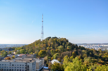 Autumn scenery view of observation deck, on the High Castle Hill covered colorful trees in Lviv,...