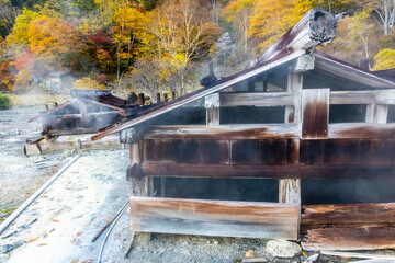 Old wooden onsen bath houses spa buildings in Nikko Japan - obrazy, fototapety, plakaty