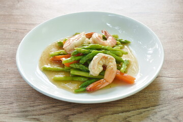 stir fried asparagus and carrot with shrimp in oyster sauce on dish