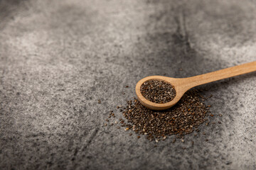 Chia in a wooden spoon close-up.Superfood. Healthy food. Diet. The concept of proper nutrition. antioxidant. Place for text, space for copy.
