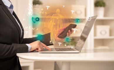 Doctor working on laptop with healthcare concept