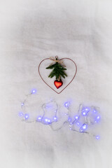 Advent wreath with the word Love on a white background.