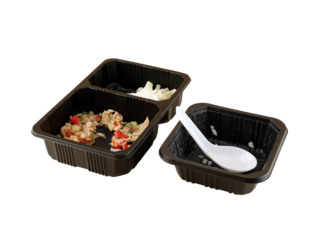few grain of steamed rice with white plastic spoon in black plastic deep tray and spicy tuna salad in two hole plastic tray isolated on white background, food waste in disposable microwave containers